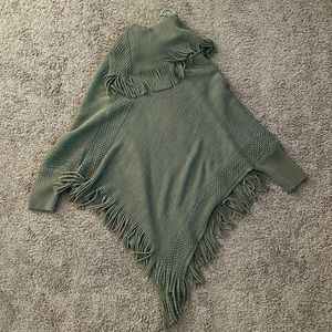Green turtleneck poncho sweater